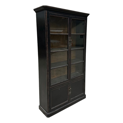 728 - A Chinese ebonised elm bookcase on cupboard in the European taste with a moulded cornice above a pai... 