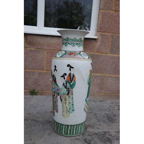 536 - A large pair of Chinese famille vert vases decorated with figures, six character blue mark to the un... 