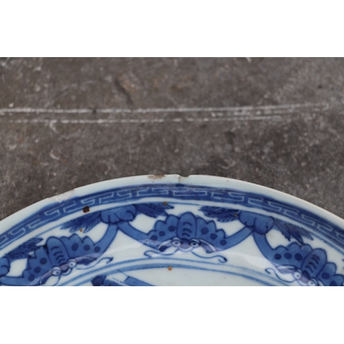 543 - A Chinese blue & white plate depicting Shoulau presenting a small boy to deities, four character blu... 