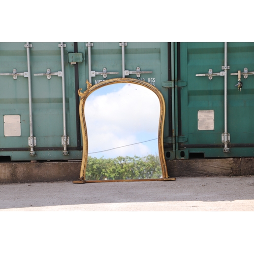 736 - A 19th century arched carved giltwood and gesso overmantle mirror, 125cms wide.