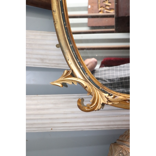 736 - A 19th century arched carved giltwood and gesso overmantle mirror, 125cms wide.