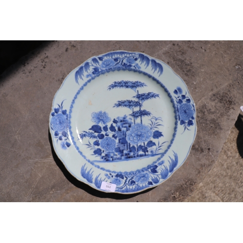 552 - A Chinese blue & white charger decorated with bamboo and flowers, 42cms diameter.