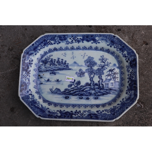 494 - An 18th century Chinese octagonal meat plate decorated with a river landscape scene, 31cms wide; tog... 