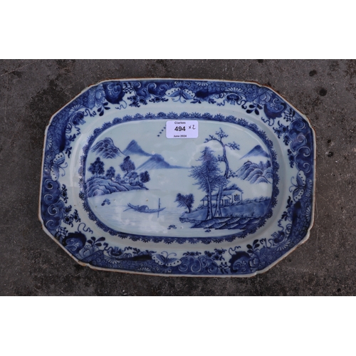 494 - An 18th century Chinese octagonal meat plate decorated with a river landscape scene, 31cms wide; tog... 