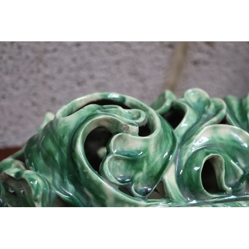 185 - A Rococo style green lustre glaze wall bracket, 30cms wide.