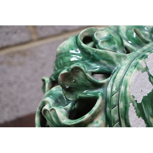 185 - A Rococo style green lustre glaze wall bracket, 30cms wide.