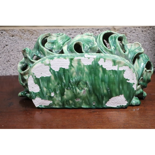 185 - A Rococo style green lustre glaze wall bracket, 30cms wide.