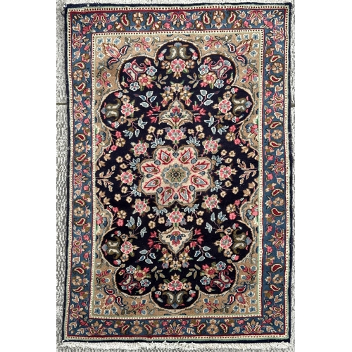 109 - A Persian Kerman carpet with central medallion and floral sprays within a floral and boteh border, o... 