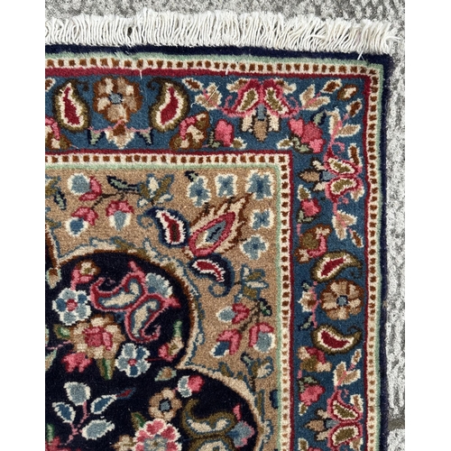 109 - A Persian Kerman carpet with central medallion and floral sprays within a floral and boteh border, o... 