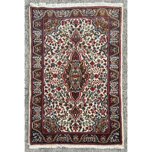 112 - A good quality Persian Kerman rug with stylised floral design and elongated central medallion, withi... 