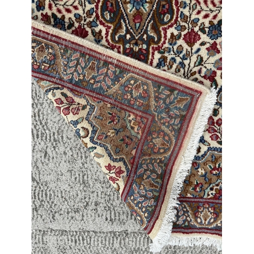 112 - A good quality Persian Kerman rug with stylised floral design and elongated central medallion, withi... 