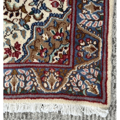 112 - A good quality Persian Kerman rug with stylised floral design and elongated central medallion, withi... 