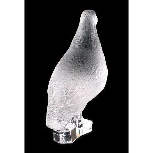 272 - A Lalique frosted glass model of a standing partridge with etched signature, 17cms high.