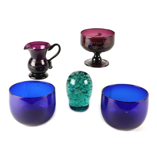 275 - An early 19th century amethyst glass sugar bowl and milk jug; together with a pair of blue glass fin... 