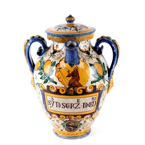 296 - An Italian Maiolica twin-handled apothecary jar and cover (possibly 17th century), 40cms high.Condit... 