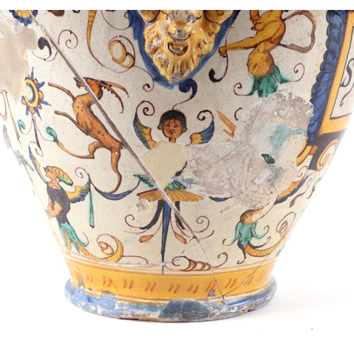 296 - An Italian Maiolica twin-handled apothecary jar and cover (possibly 17th century), 40cms high.Condit... 