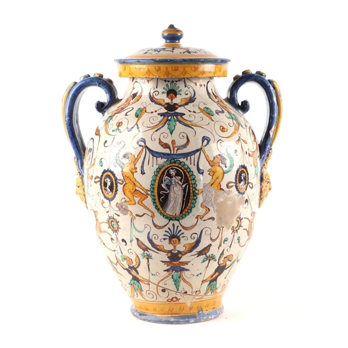 296 - An Italian Maiolica twin-handled apothecary jar and cover (possibly 17th century), 40cms high.Condit... 