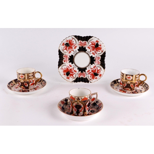 298 - Three Royal Crown Derby Imari pattern cups and saucers; together with a similar side plate.