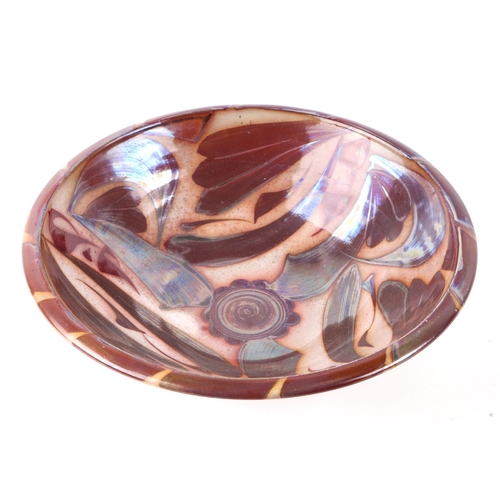 300 - An Aldermaston copper lustre footed bowl designed by Alan Caiger-Smith, 23cms diameter.