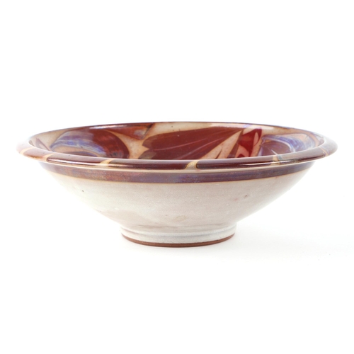 300 - An Aldermaston copper lustre footed bowl designed by Alan Caiger-Smith, 23cms diameter.