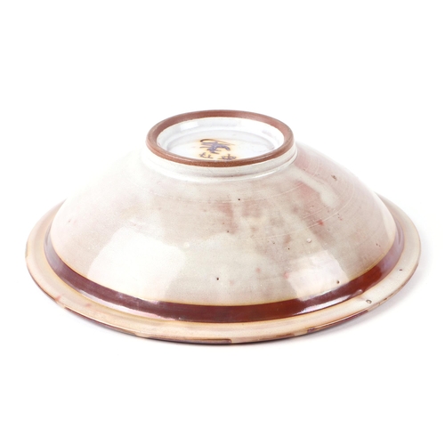 300 - An Aldermaston copper lustre footed bowl designed by Alan Caiger-Smith, 23cms diameter.