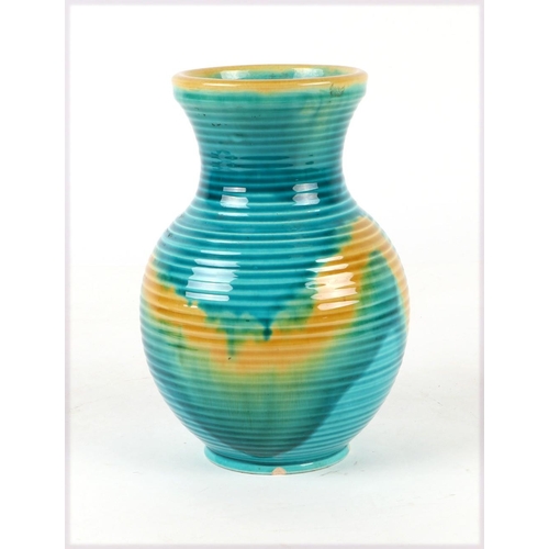 303 - A French Accolay pottery cuff vase. 21cm high