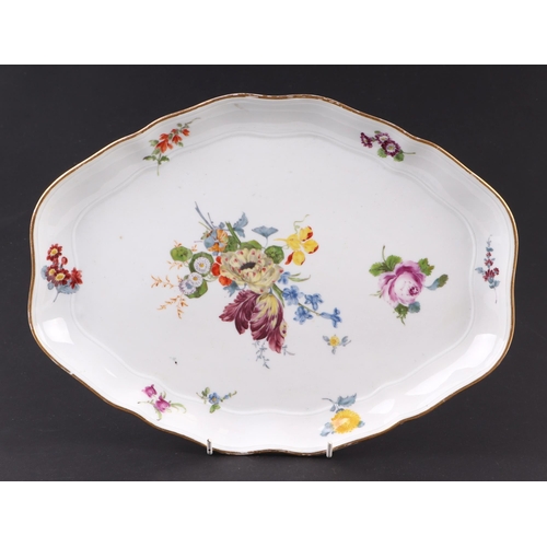 313 - A Meissen porcelain shaped oval shallow dish, hand decorated with sprays of flowers, 32cms wide.