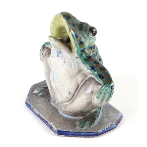 328 - A Studio pottery model of a frog, 15cms high.