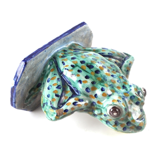 328 - A Studio pottery model of a frog, 15cms high.