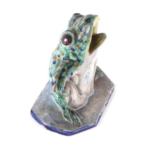 328 - A Studio pottery model of a frog, 15cms high.