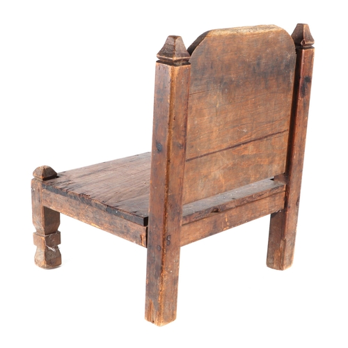 331 - An Afghan Khyber Pass Swat Valley tribal carved wooden low chair.