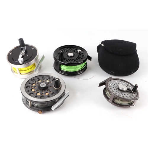 335 - A group of fly fishing wheels to include a JW Young & Sons Masterline DT10SF; a Gladding Intrepid; a... 