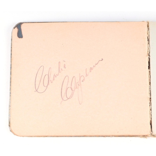 34 - An early 20th century autograph book with various actors and personalities signatures to include Cha... 