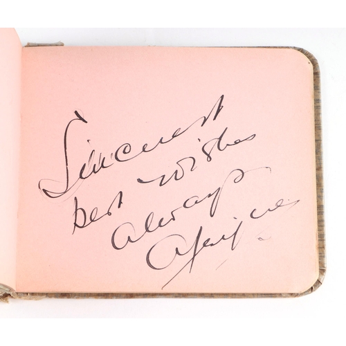 34 - An early 20th century autograph book with various actors and personalities signatures to include Cha... 