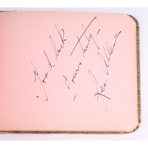 34 - An early 20th century autograph book with various actors and personalities signatures to include Cha... 