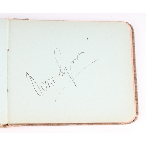 34 - An early 20th century autograph book with various actors and personalities signatures to include Cha... 