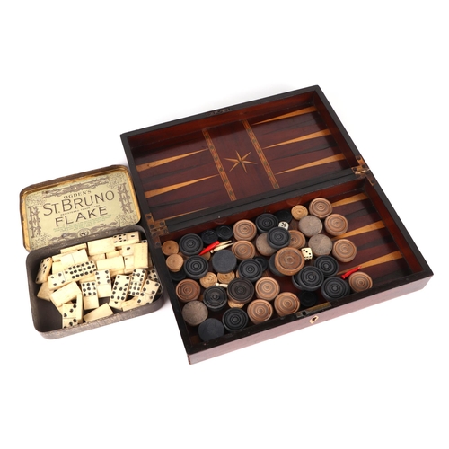 349 - A 19th century combination chess, cribbage and backgammon box; together with a set of bone dominoes,... 