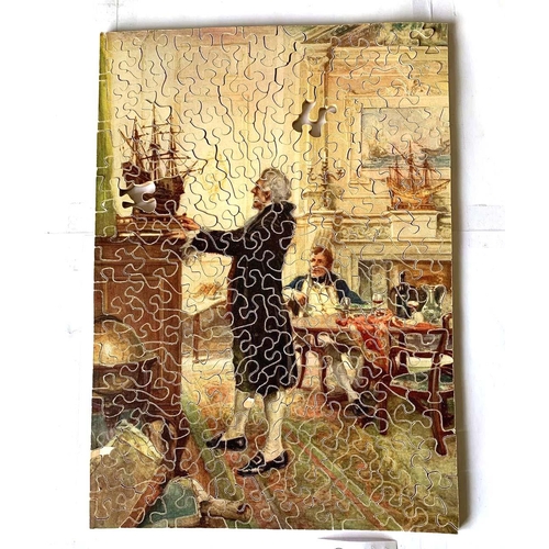 353 - A quantity of vintage jigsaw puzzles on cloth bags (10).