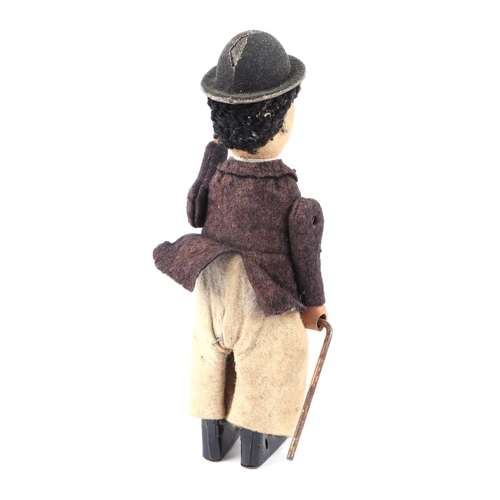 360 - An early 20th century Schuco clockwork model of Charlie Chaplin with fabric covered clothes, approx ... 