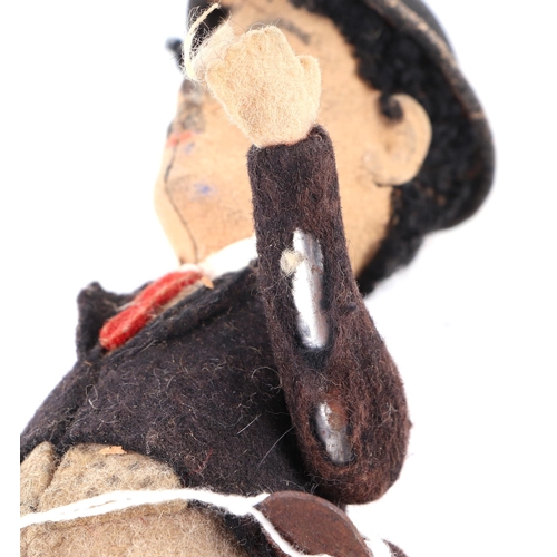 360 - An early 20th century Schuco clockwork model of Charlie Chaplin with fabric covered clothes, approx ... 