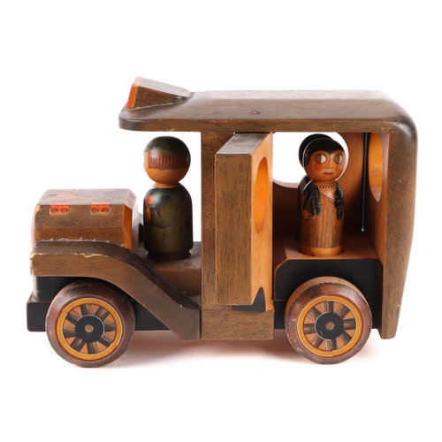 361 - Three carved and painted wooden toys to include a taxi, signed & dated 'Nic 86', 30cms, a racing car... 