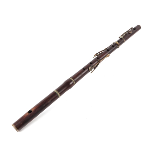 369 - A rosewood flute, 64cms long (a/f).