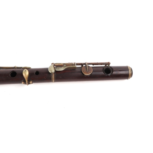 369 - A rosewood flute, 64cms long (a/f).