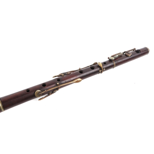 369 - A rosewood flute, 64cms long (a/f).