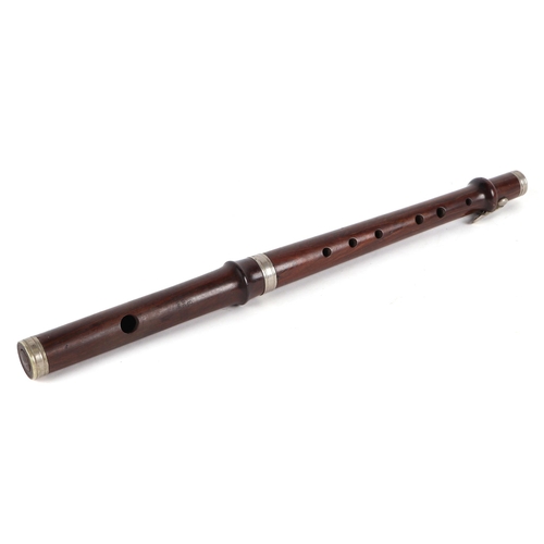 373 - A rosewood piccolo, stamped 'Improved London B', 38cms long.