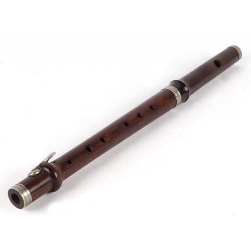 373 - A rosewood piccolo, stamped 'Improved London B', 38cms long.