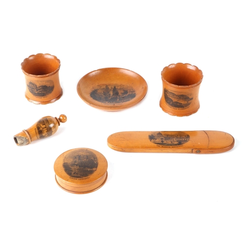 381 - A group of Victorian Mauchlinware to include a spectacle case, a whistle and napkin rings (6).