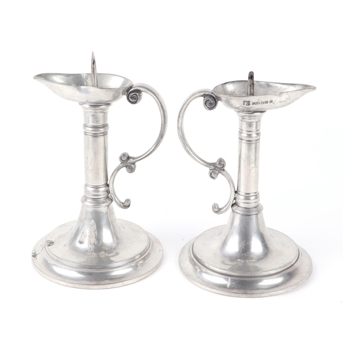 388 - A pair of pewter pricket candlesticks. 19cm high