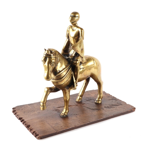 389 - A brass / polished bronze of a medieval knight on horseback, 32cms high.