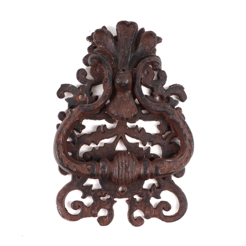 394 - A large steel door knocker with pierced scroll decoration, 13cms wide.